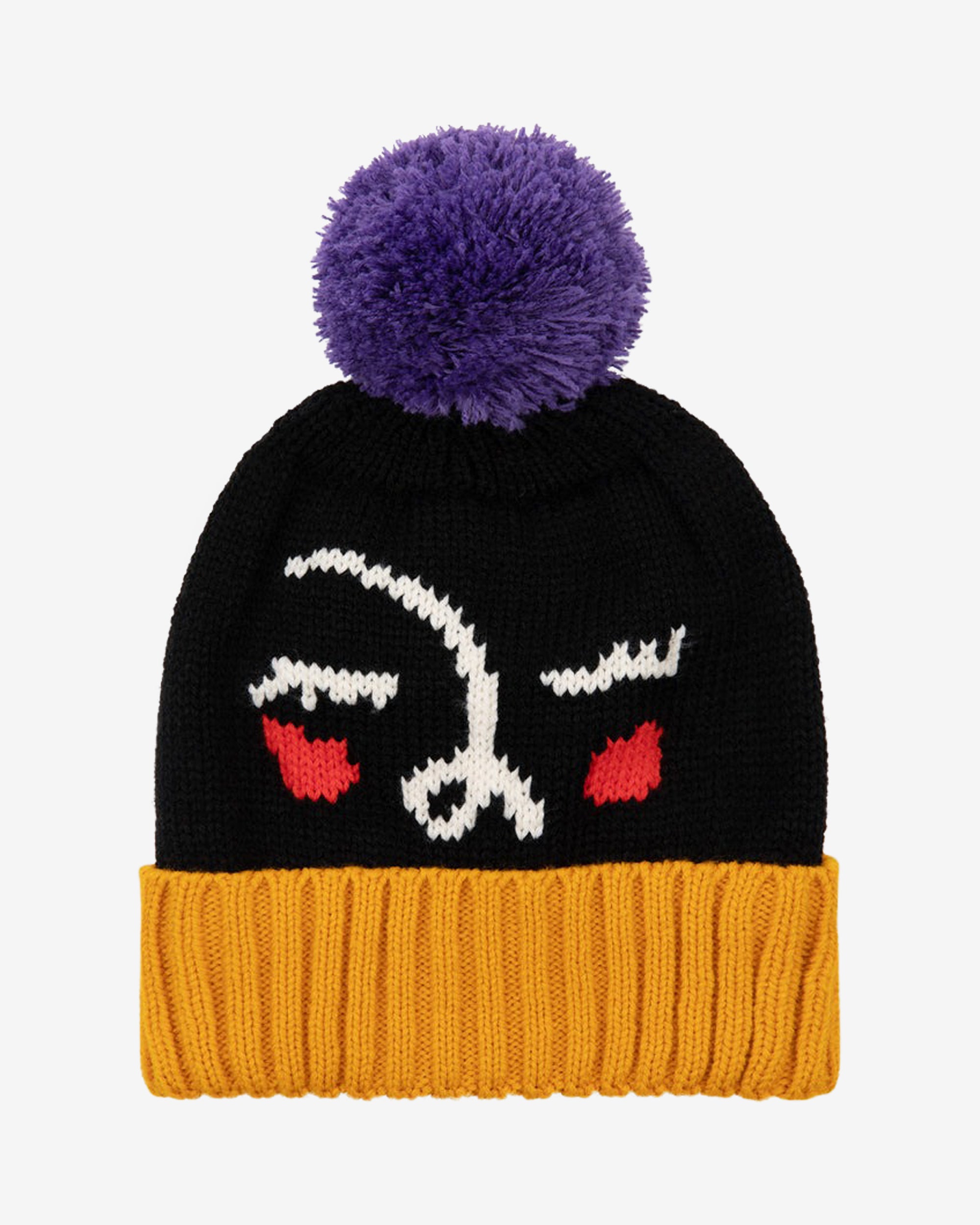 A black and yellow beanie with a purple pom-pom on top, featuring an abstract face design with red accents for eyes and a purple turn-up rim at the bottom.