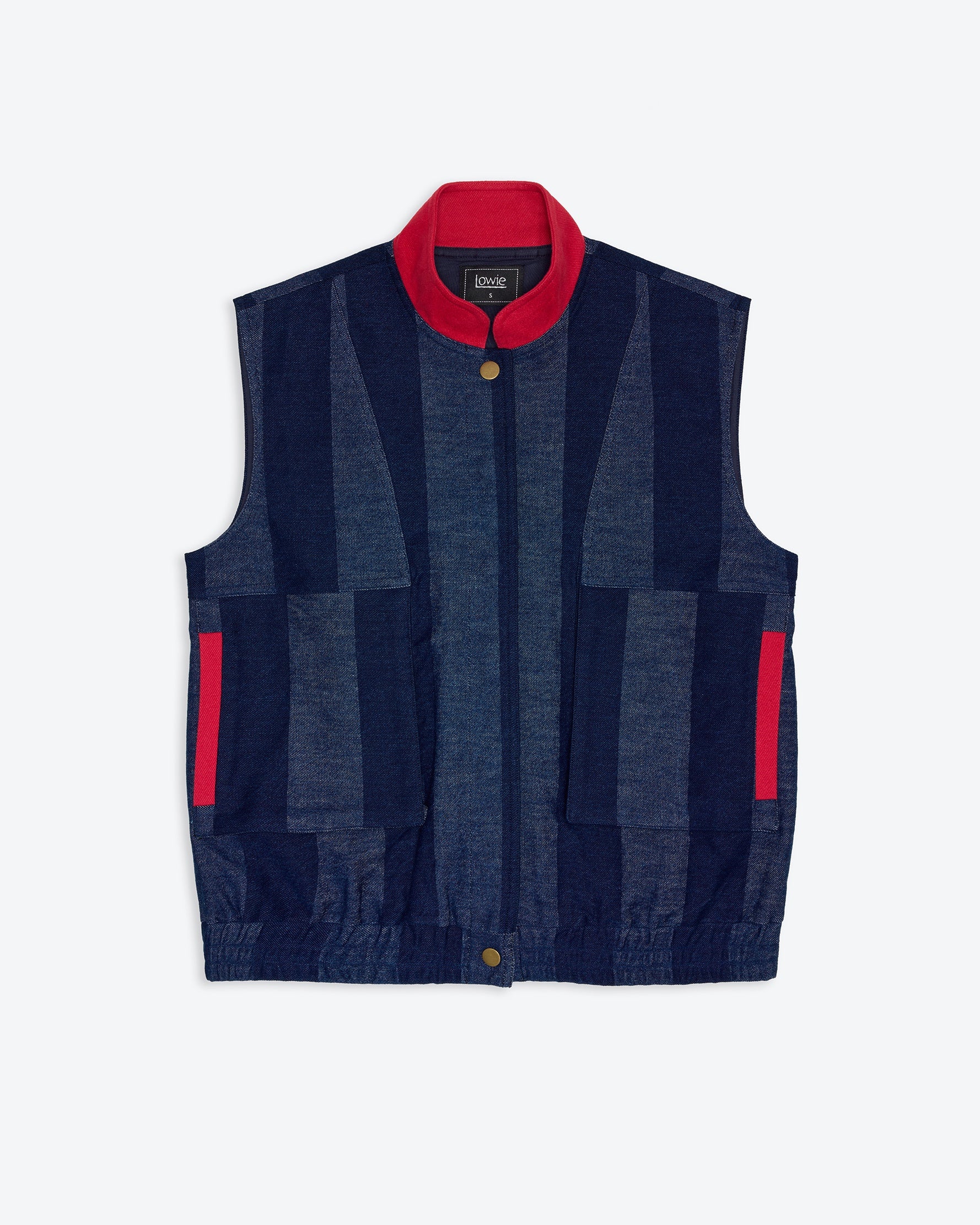 Navy denim stripe vest with red accents on a white background