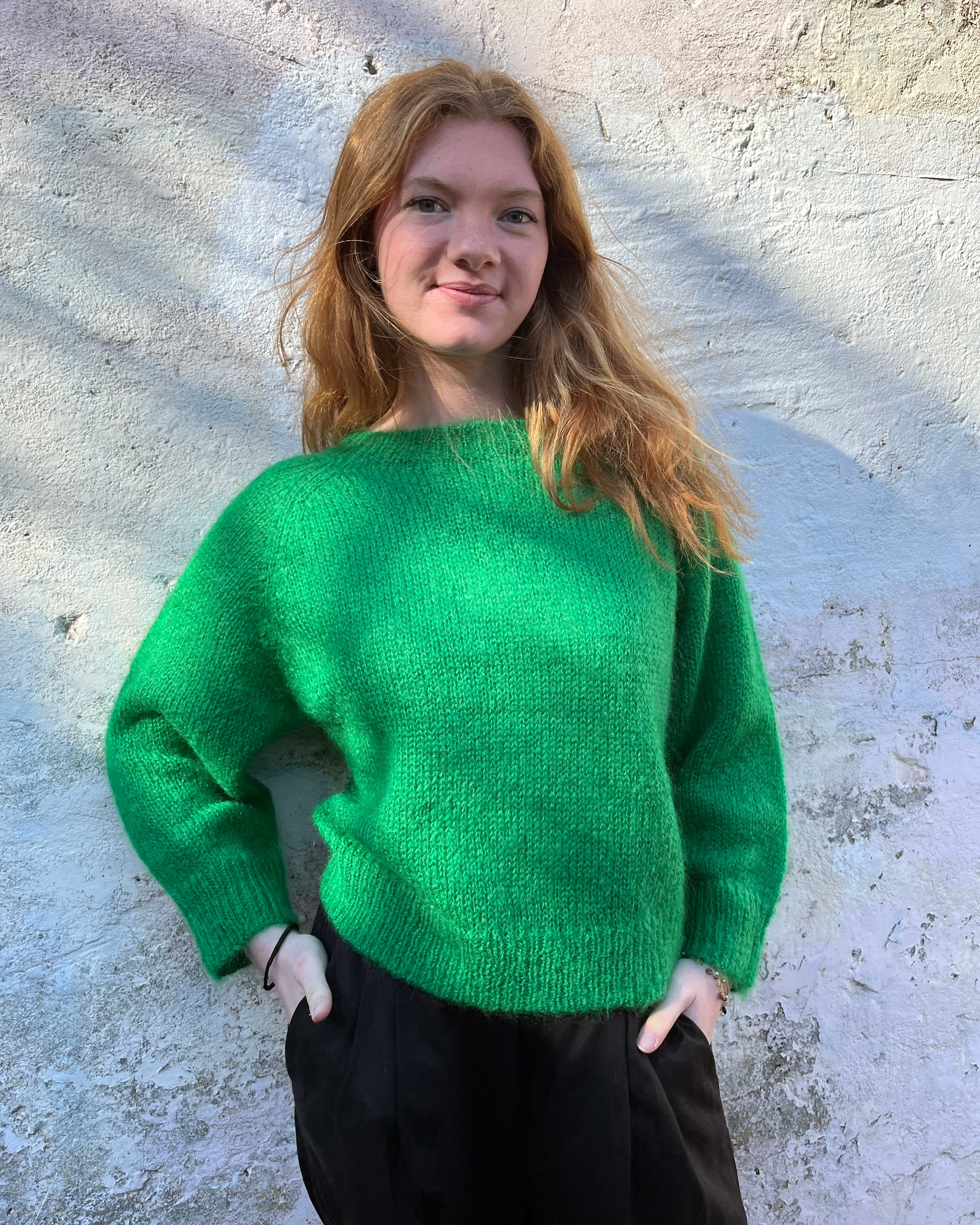 Person Wearing a bright green mohair jumper