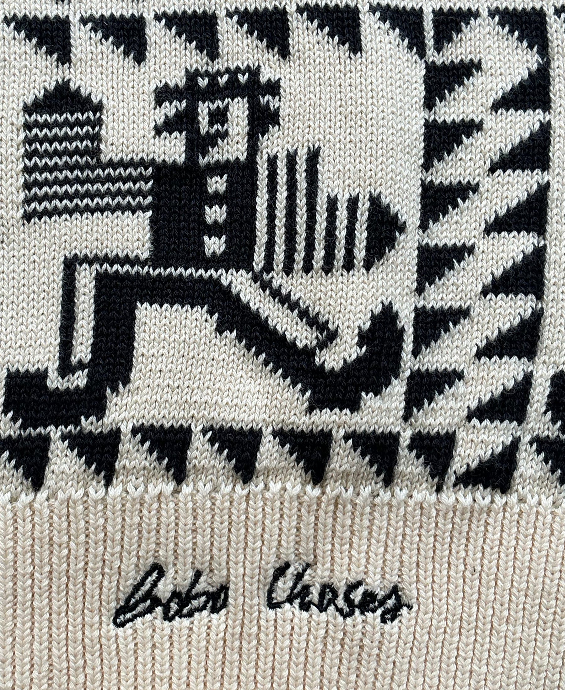 Textured fabric with black and white pattern and 'Bobo Choses' branding.
