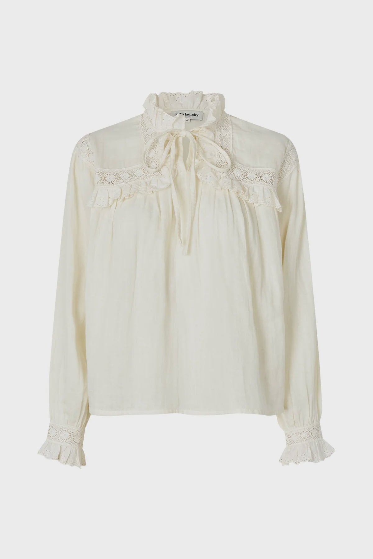White blouse with lace details on a white background