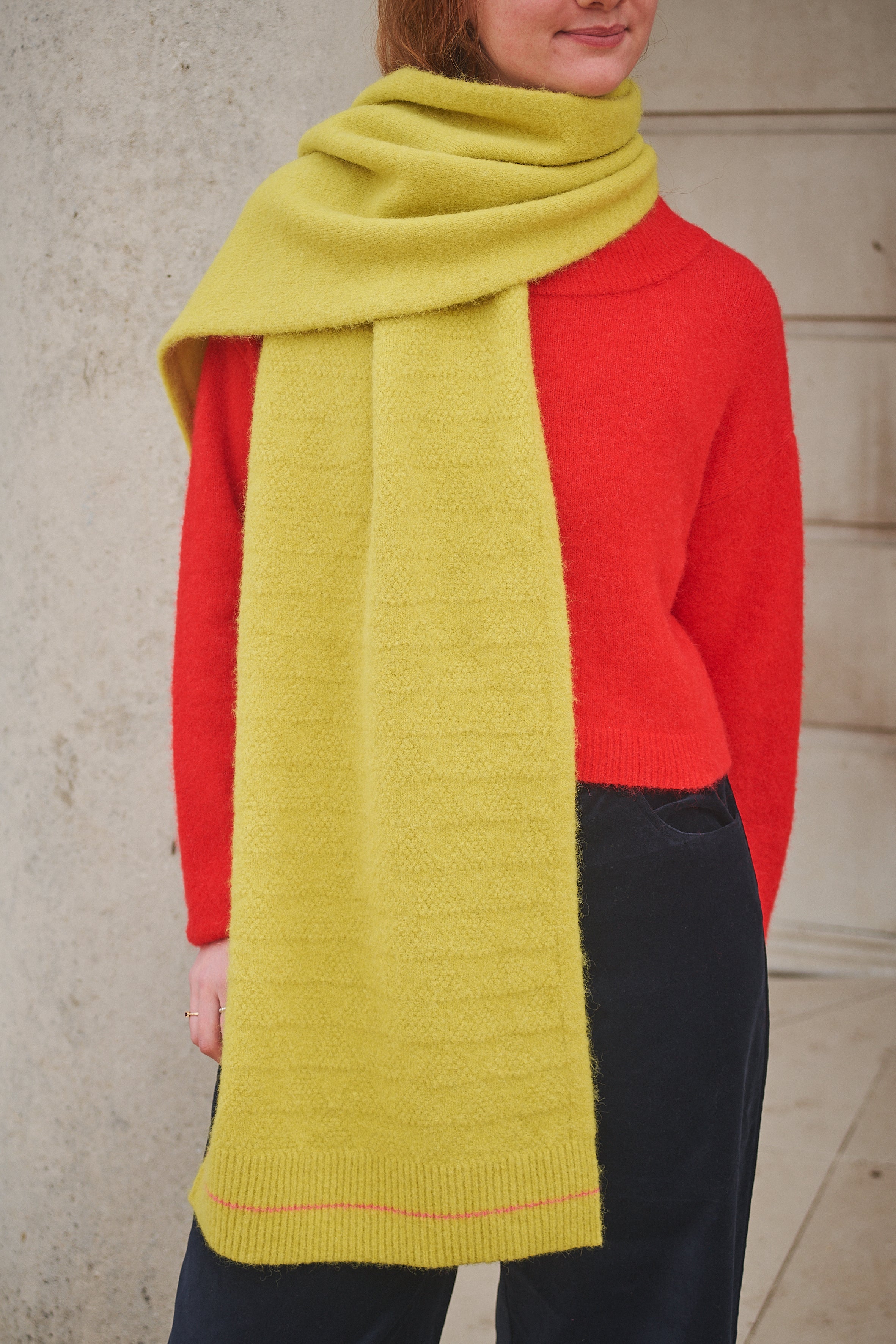 Person Wearing Yellow Scarf and red jumper 