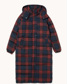 A long hooded puffer coat with a red and navy blue plaid pattern, shown flat against a light cream background.