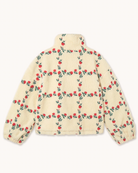 A cream-colored sherpa fleece jacket with an all-over embroidered pattern of red roses and green leaves, shown from the back on a light off-white background.