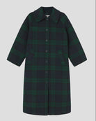 A dark green and black plaid coat with a collar and front buttons, displayed against a solid gray background.