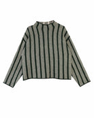 A cropped knit sweater with vertical stripes in black and cream, featuring a mock neck and long sleeves, laid flat against a white background.